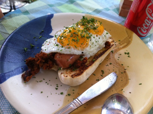 Gourmet hotdog sadnwich with chili con carne and sunny side up egg (P240)